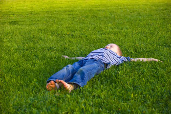 kid in grass