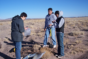 Jani Ingram and students standing outside 