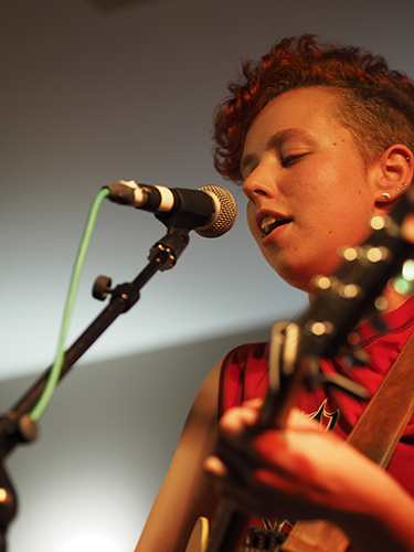 a photo of Young playing a guitar