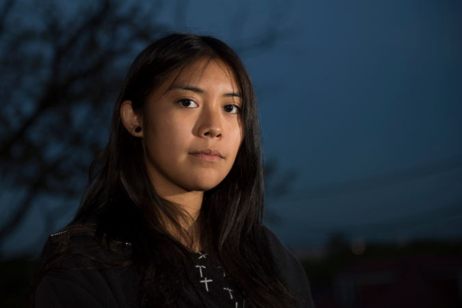 A photo of Jaime Butler against a dark sky.