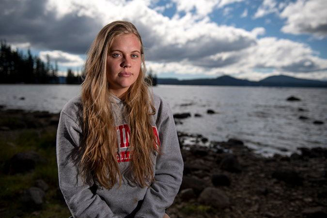 A photo of Sophie Kivlehan standing outside in fron of a scenic background.