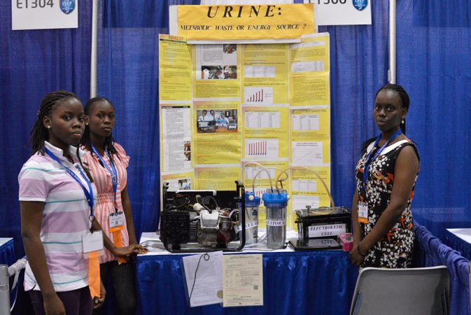 Adebola Duro-Aina (left), Oluwatoyin Faleke (center) and Zainab Bello (right) designed a system that uses urine to produce a fuel. Generators that run on this fuel, rather than gasoline, would avoid spewing carbon monoxide, a toxic pollutant. Credit: Patrick Thornton, SSP