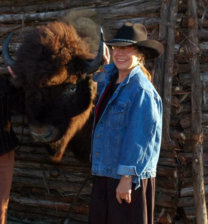 If not at work, you can usually find computer engineer Pat Teller enjoying the outdoors. Here, she poses with a stuffed bison’s head. Credit: Courtesy of Pat Teller