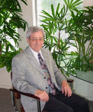 Retired NASA environmental scientist Bill Wolverton is never far from his work — the houseplants that fill his sunny home office. Wolverton is an expert in how plants can clean indoor air of sometimes dangerous contaminants. Credit: Wolverton Environmental Services