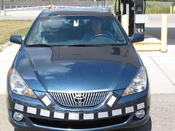 Researchers coated panels with the enzyme-containing paint and attached them to the front of this car. The coating made it easy to rinse dead bugs off the panels later. Credit: Toyota Research Institute of North America and University of Minnesota