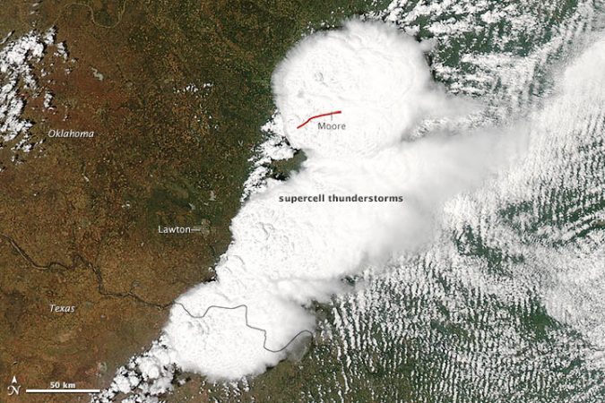 White, ball-shaped cloud structures in this satellite image point to where intense thunderstorms formed on the afternoon of May 20, 2013. The big round ball at top center is where the killer tornado developed. It ravaged Moore, Okla.Caption: Credit: Jeff Schmaltz, LANCE/EOSDIS MODIS Rapid Response Team at NASA GSFC