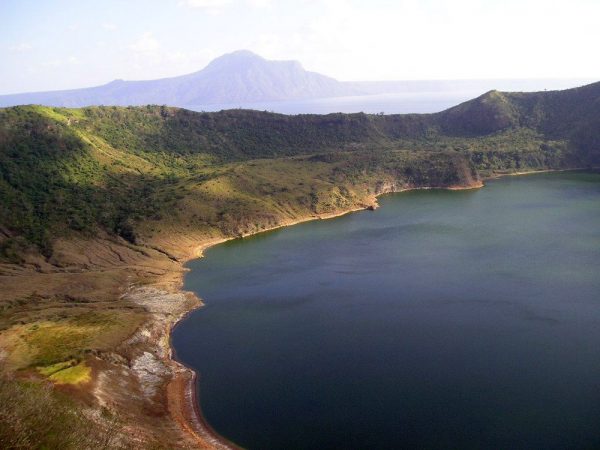 A lake sits in the crater of the Philippine’s Taal volcano. Scientists recently discovered that hot springs flowing into the lake come from a shallow source — the lake itself. Credit: MatthieuG/Wikimedia Commons