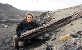 Hope Jahren with a tree fossil on Axel Heiberg Island.