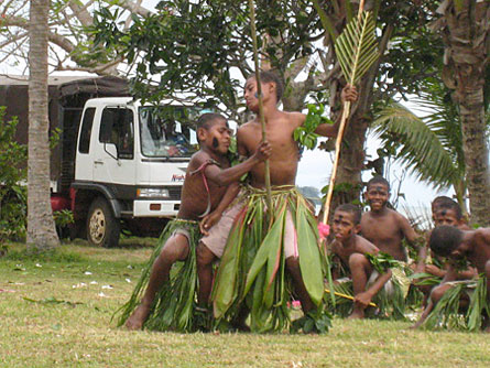 As the villagers work to conserve their culture, the children are learning traditional performances, like this customary war dance.