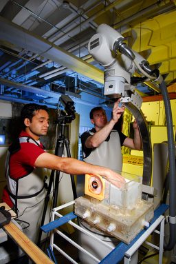 Georgia Tech physicist Dan Goldman and graduate student Ryan Maladen (left) set up a high-speed X-ray imaging system to image how sandfish move beneath the sand. Credit: Gary Meek