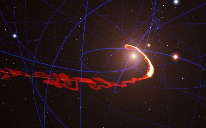 A computer simulation of what would happen to a gas cloud (the orange-yellow wisp) as it approached a black hole. In short: The cloud would be stretched and squashed like a strand of spaghetti. Credit: ESO/S. Gillessen/MPE/Marc Schartmann