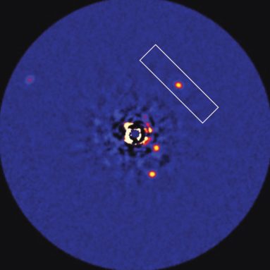 Bright dots depict the infrared radiation emitted by the four known planets circling the star HR 8799. The planet HR 8799c is in the rectangular box. Credit: Image courtesy of C. Marois/NRC-HIA, W.M. Kech Observatory