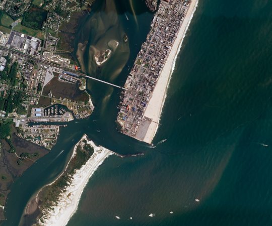 A 1933 hurricane hit the East Coast of the United States. It created a breach in Assateague Island. The new channel cut off Ocean City, Md., (at right) from the rest of the barrier island. Left largely wild and undeveloped, Assateague (at left) has steadily shifted closer to shore. Credit: USGS/Nat’l Map/Nat’l Agric’l Imagery Prog.