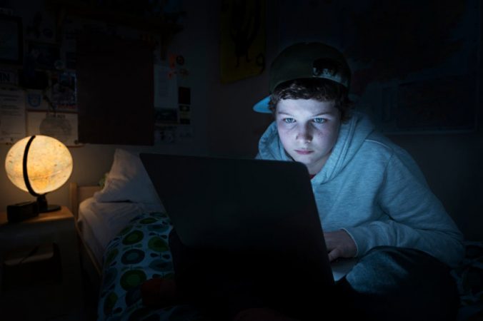 kid on computer late at night