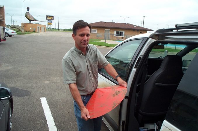 Tim Samaras holds one of the smaller probes he designed to set on the ground, right in the path of a tornado. It collects information on the intensity of the winds as the storm passes over it. Credit: T. Samaras