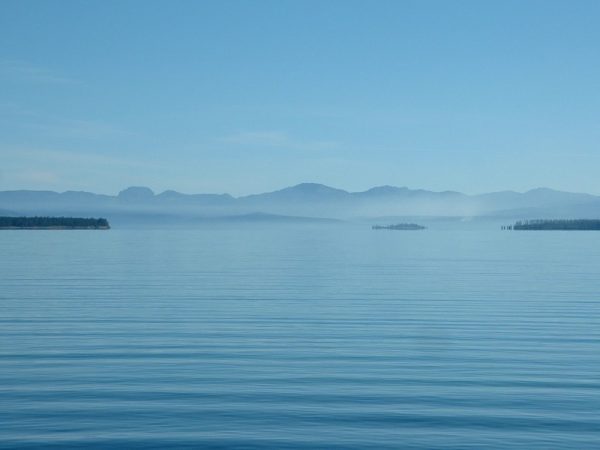 Scientists have been studying seiches, or large waves that slosh back and forth, in Yellowstone Lake to better understand what lies beneath. Credit: Seglea