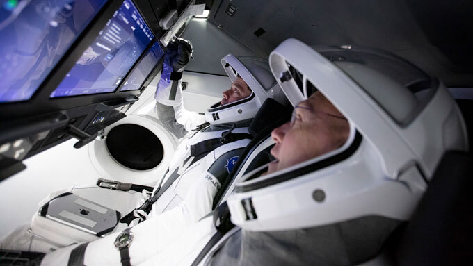 NASA astronauts in a flight simulator