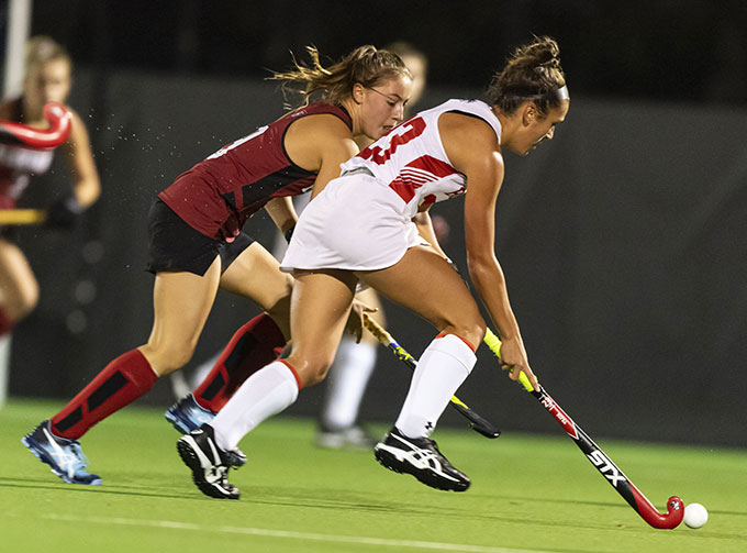 women playing field hockey