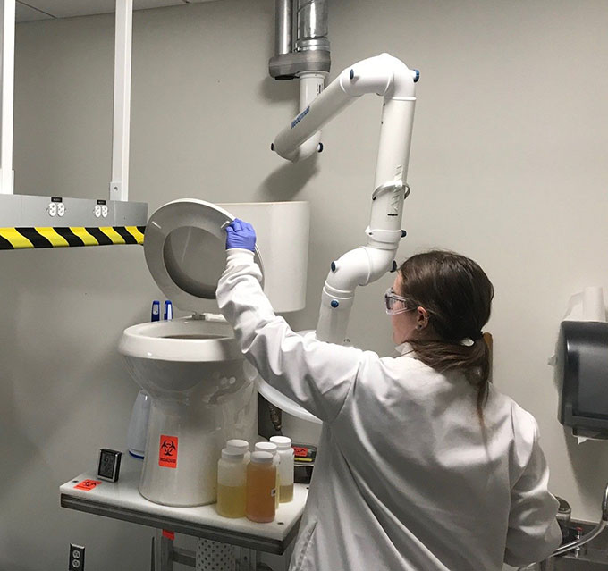 a researcher working with the Smart Toiled in the lab