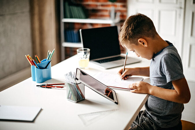 a boy studying at a table