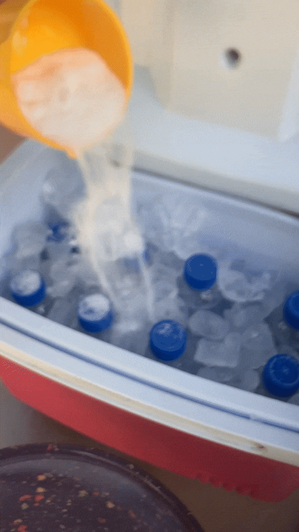 animated image of salt poured into ice in a cooler
