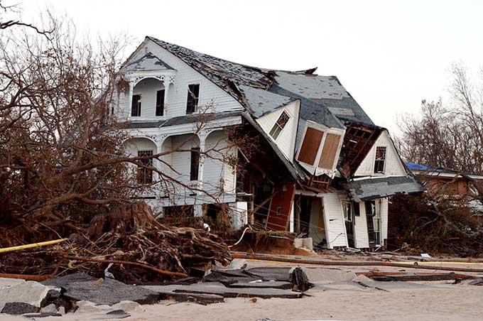 a photo of a destroyed beach house