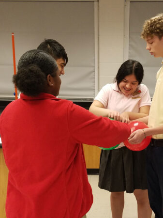 students in a classroom desiging balloon rockets