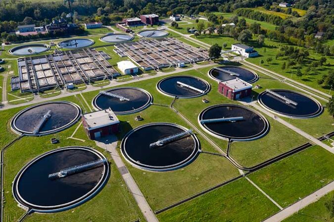 an aerial photo of a large sewage treatment plant