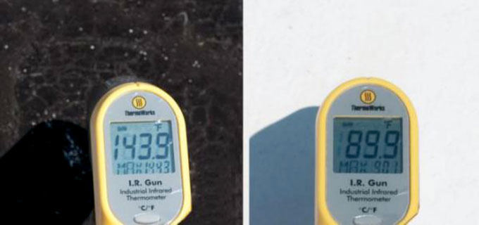 a photo of temperature readings on a black roof and on a white roof