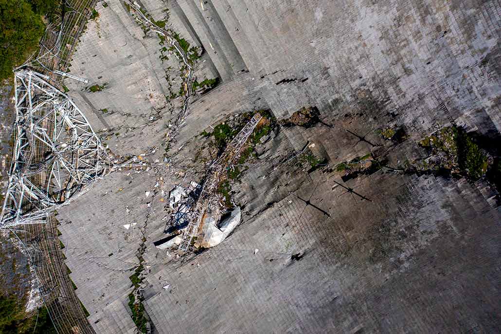 an aerial photo showing Arecibo's shattered dish