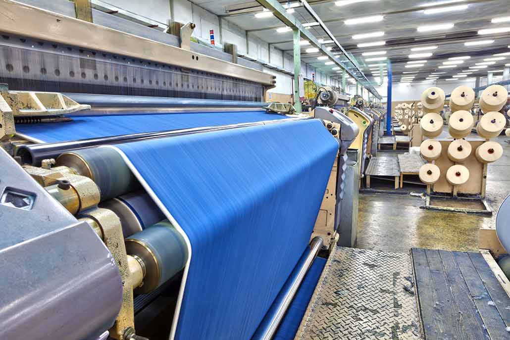 a photo of a factory weaving denim