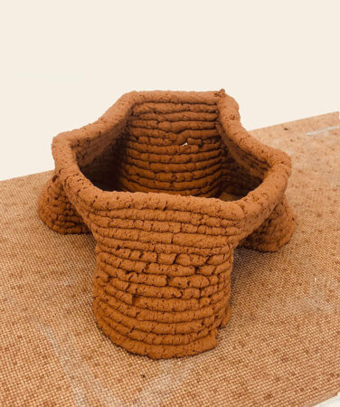 a small structure 3D printed using a soil based material