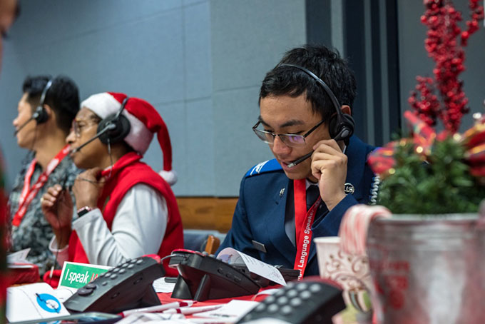 a photo of some of the volunteers taking phone calls at NORAD headquarters in 2019
