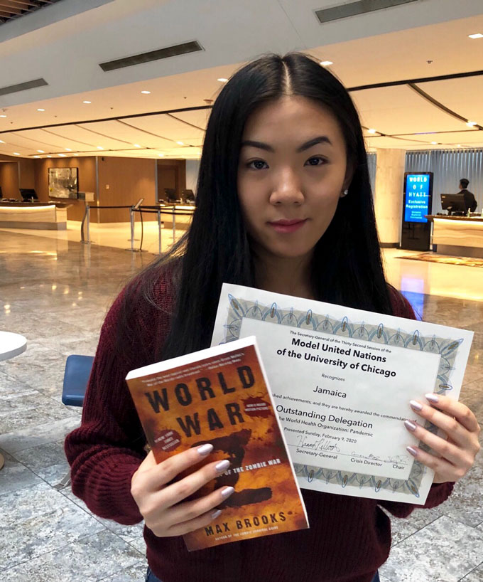 Vivian Yee posing inside a convention center