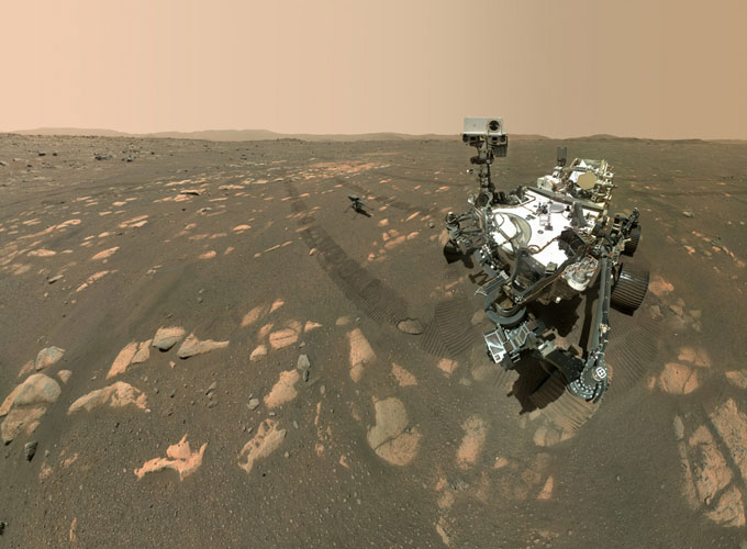 selfie image of Perseverance rover with Ingenuity helicopter in the background