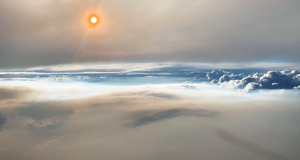 thunder clouds above clouds of smoak