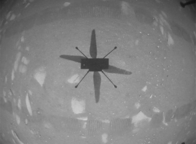 image of the Ingenuity helicopter's shadow during its first flight