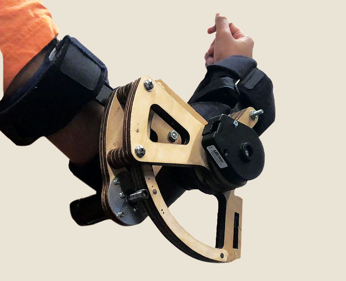 haptic feedback system that applied force near the elbow