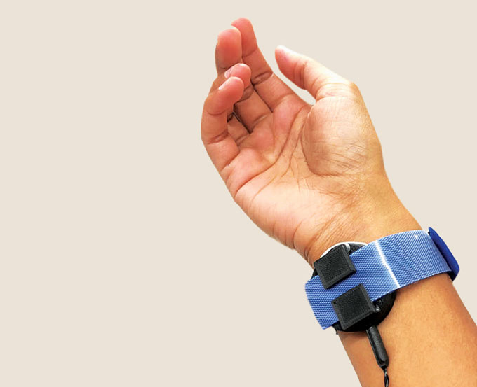 haptic feedback system that applied force near the elbow