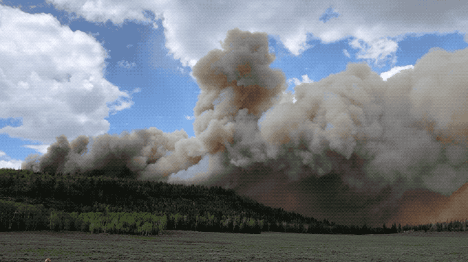 smoke from an experimental fire billowing over Fishlake National Forest