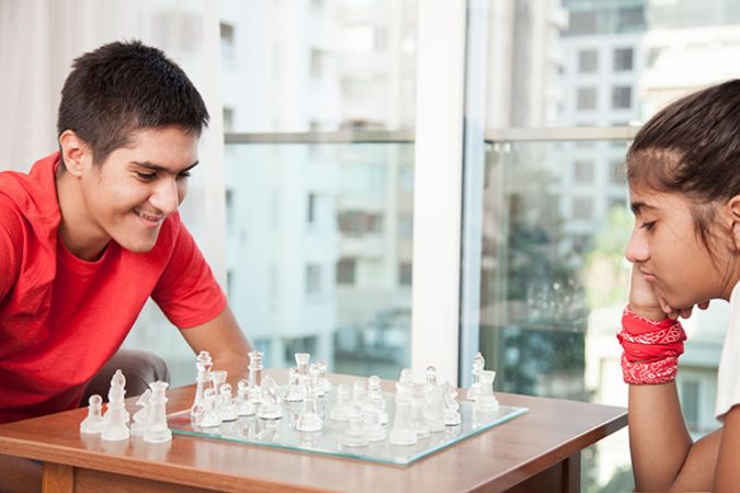 two kids playing chess