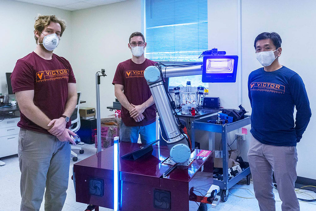 a photo of three robotics engineers with DINGO