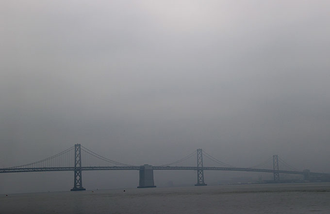 smoky sky over oakland bay bridge
