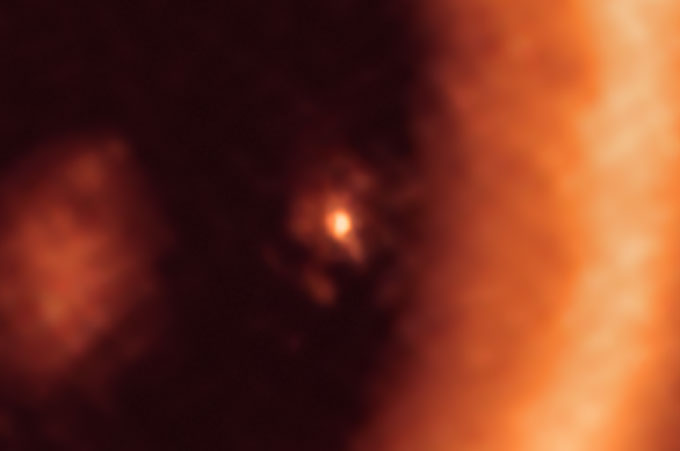 close-up of potential moon forming inside ring of debris around planet PDS 70c