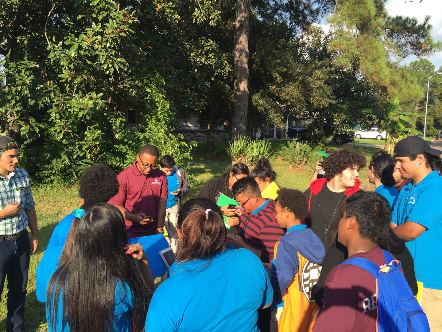 high school students who study storm water gather