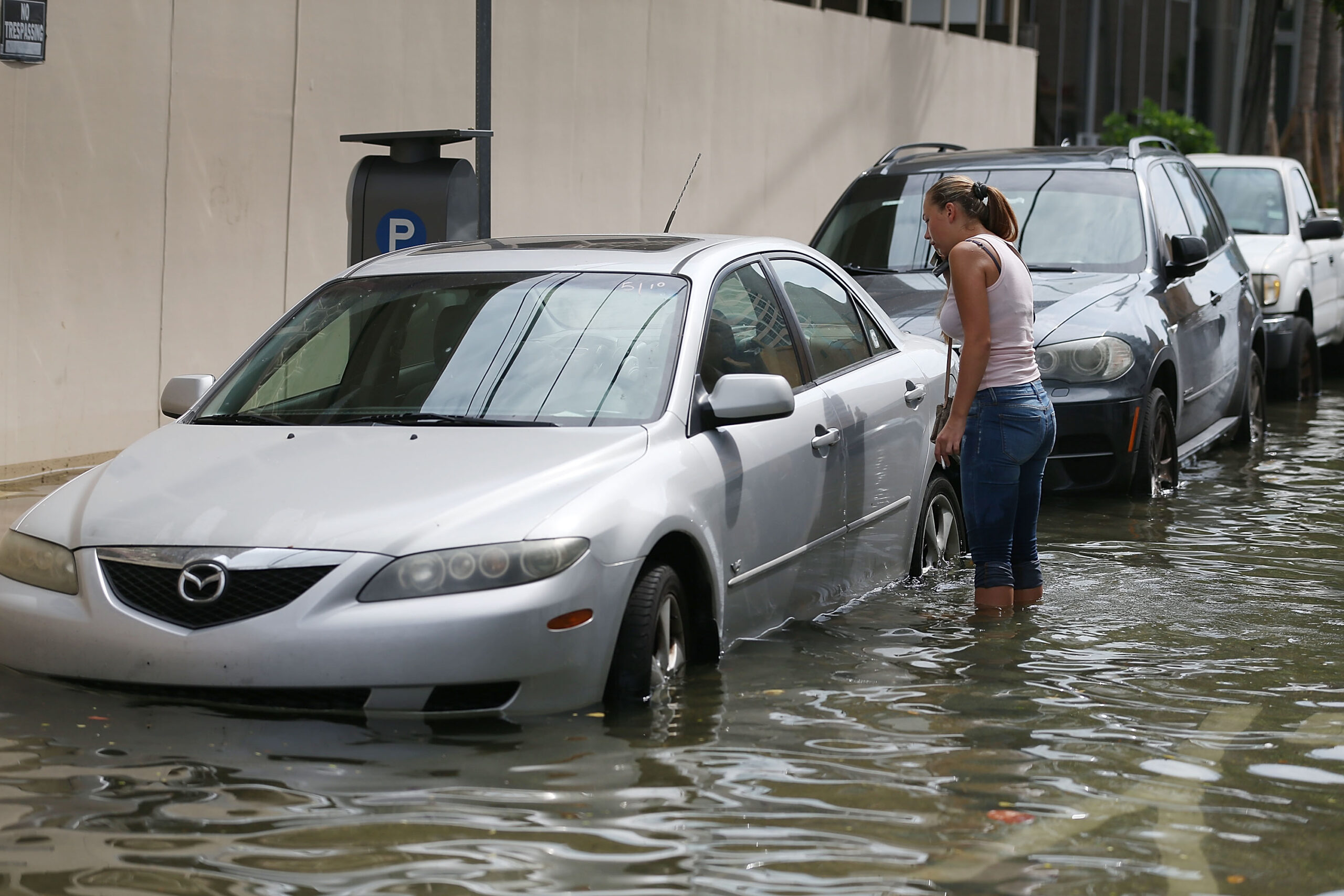 cars parked on a flooded street