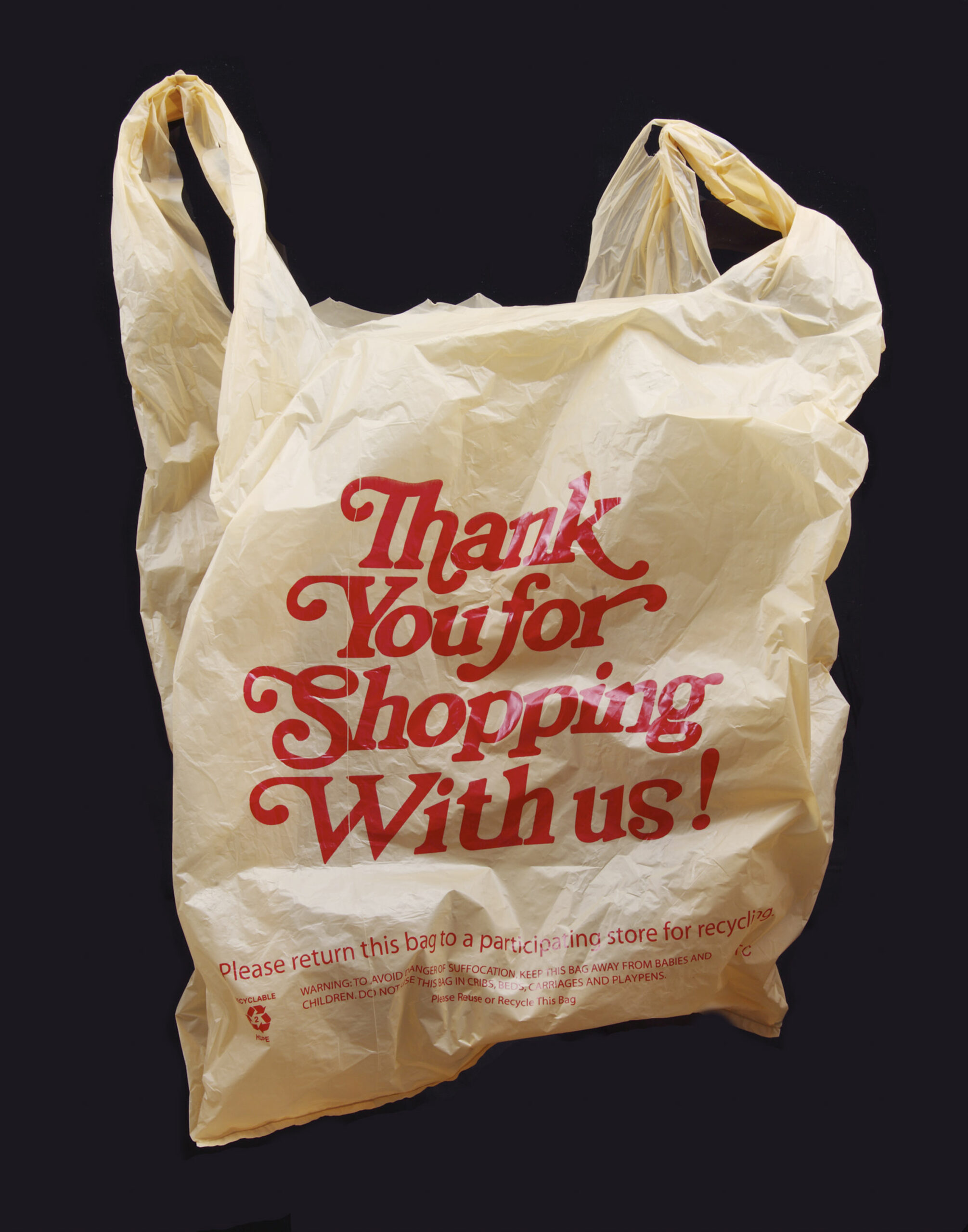 a plastic shopping bag with 'thank you for shopping with us' printed in red on the side
