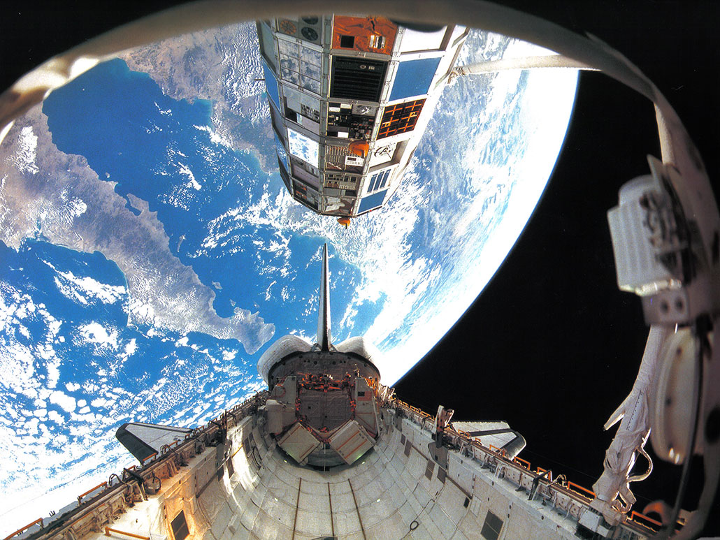 a photo from Earth orbit of the Long Duration Exposure Facility and the space shuttle