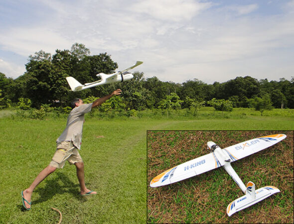 a photo of a man launching a model plane based drone into the air, there is an inset showing the drone on the ground