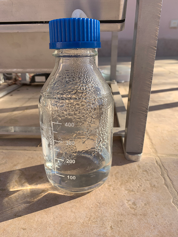 a small water bottle with a little more than 100 mL of water